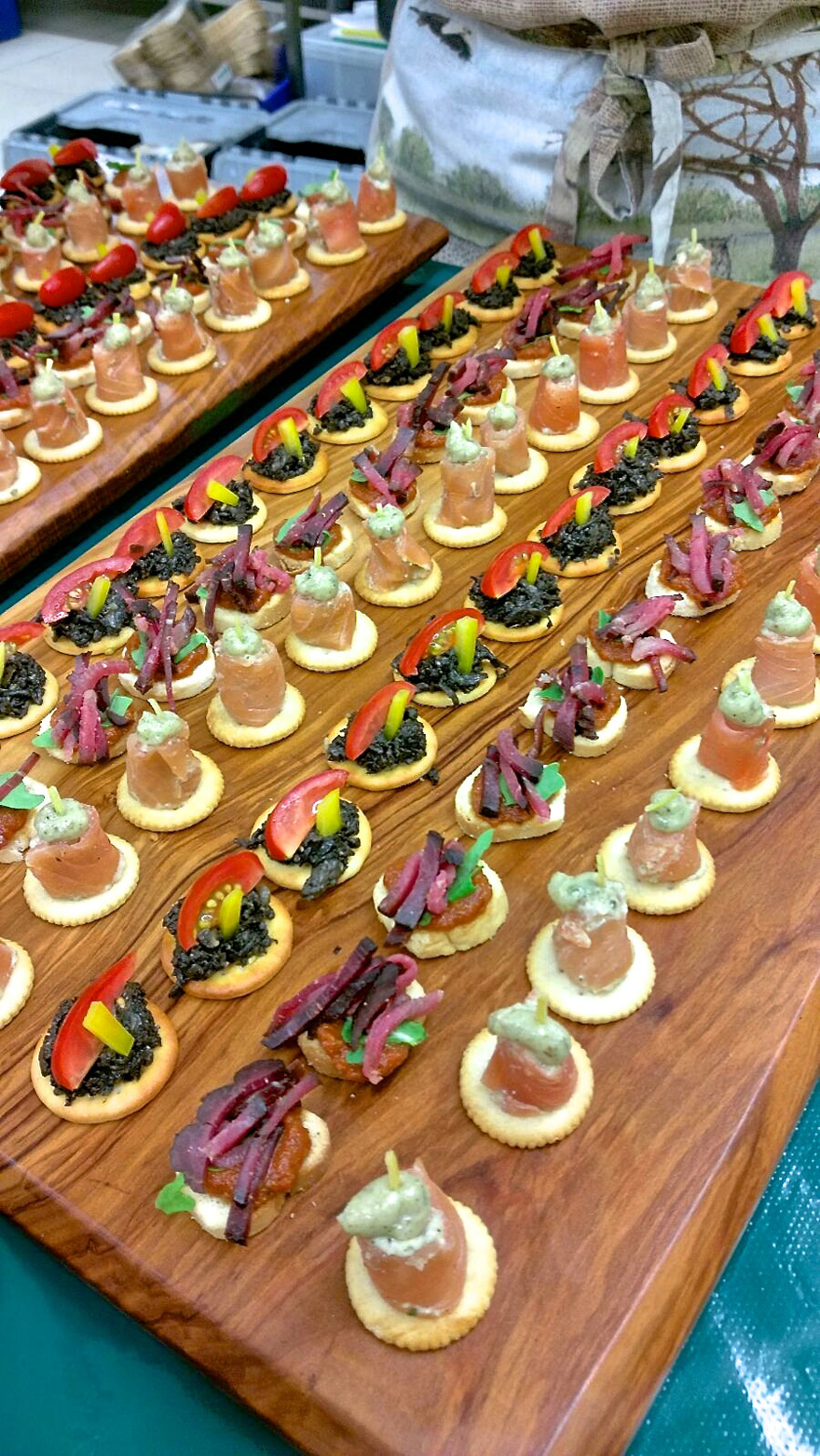 Assorted Challas canapés served on wooden boards